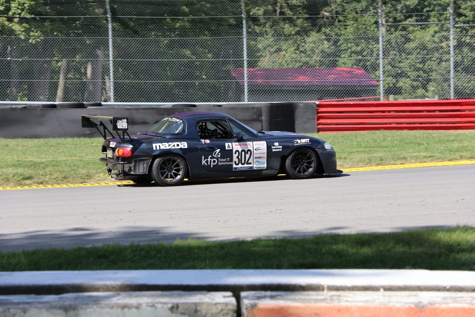 Senhauser Racing #302 Mazda Miata on track at Mid-Ohio Sports Car Course